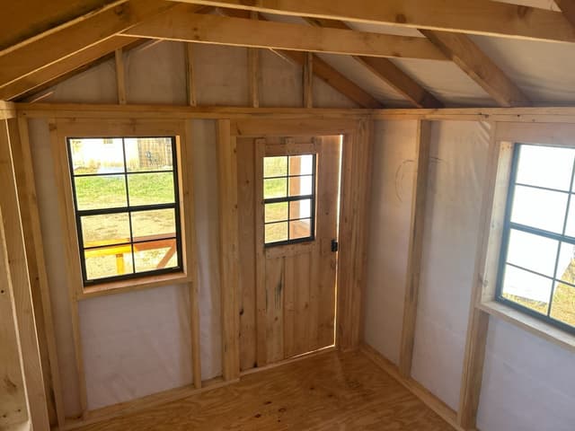 Interior view of a cabin-style tiny home on a trailer